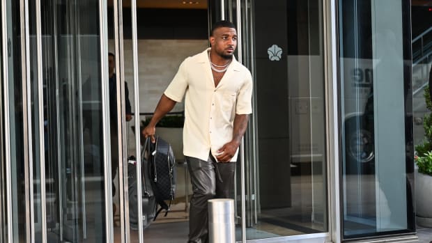 Quandre Diggs walking outside.
